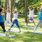 Yoga teacher and seniors in a park